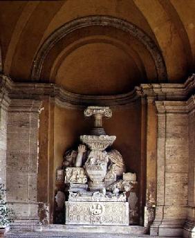 The inner courtyard detail of a niche displaying a collection of fragmentary antique sculpture