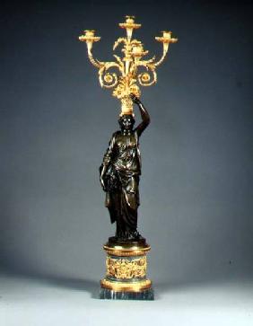Louis XVI four-light candelabraormolu branches rising from a basket balanced on the head of a patina c.1775
