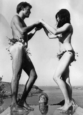 Salvador Dali looking at his models standing on thick glass plate posing for new painting of Sardana - English Celebrities Photographer