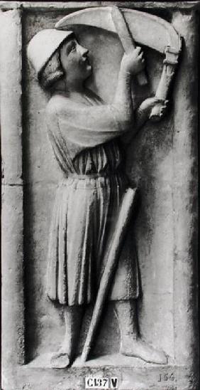 Peasant sharpening his scythe for the haymaking, representing the month of June, from the Portal of from the P