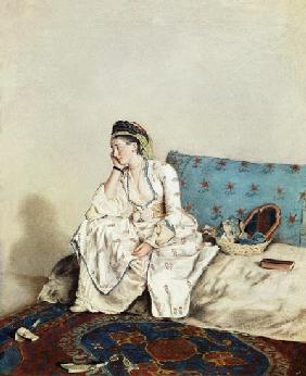 Dame in orientalischer Tracht auf einem Divan