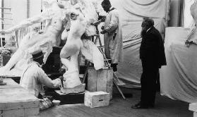 Auguste Rodin (1840-1917) in his Paris studio watching the construction of a sculpture, 1905 (b/w ph