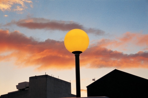 Late sunset on summer evening yellow street-light, Berne (photo)  von 