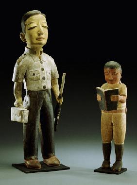 Two Makonde Figures Of European Men, One Readng A Book