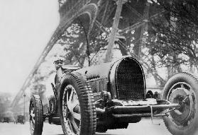 The French writer Paul Morand at the foot of the Eiffel Tower in 1929