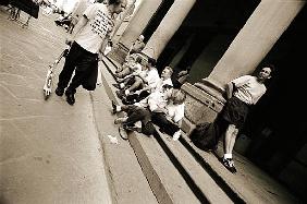 Man wearing a ''Jesus'' T-shirt staring at lovers, 2004 (b/w photo) 